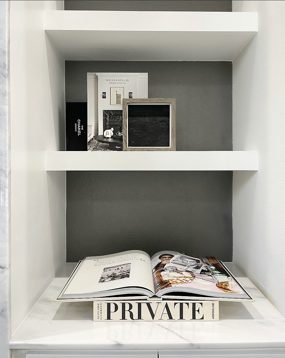 Built-in shelving with Private Assouline and art objects