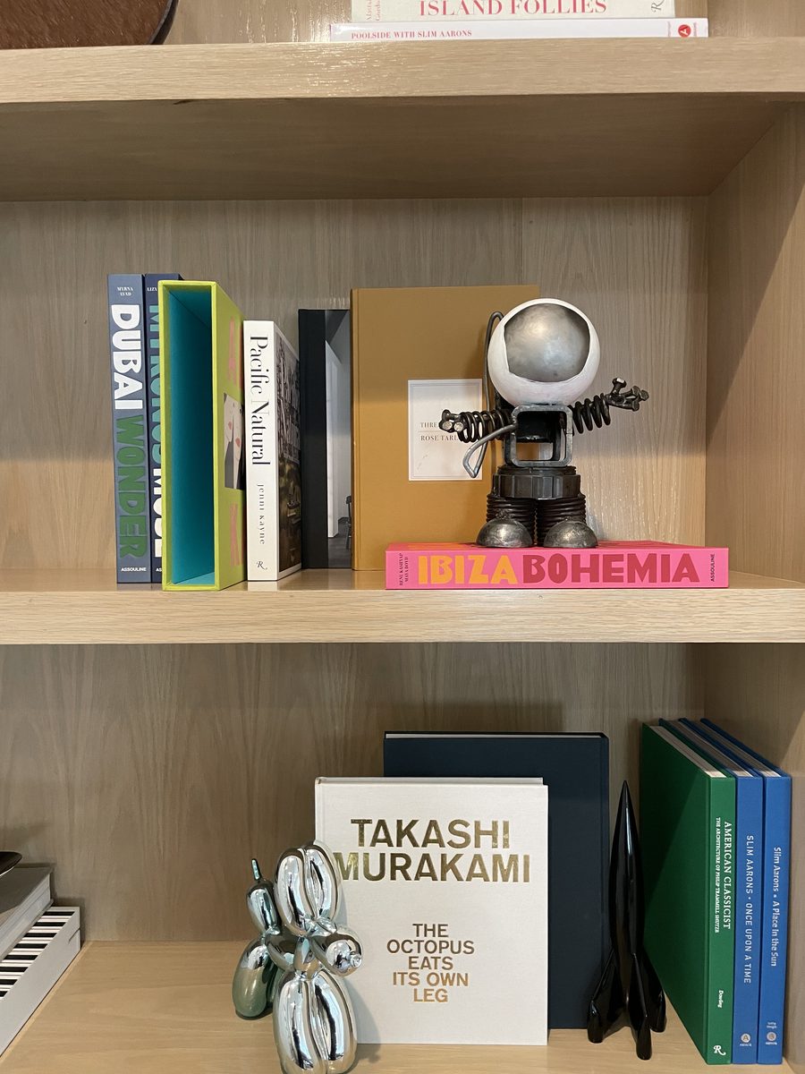 Oak bookcase with Ibiza Bohemia, Takashi Murakami and Slim Aarons